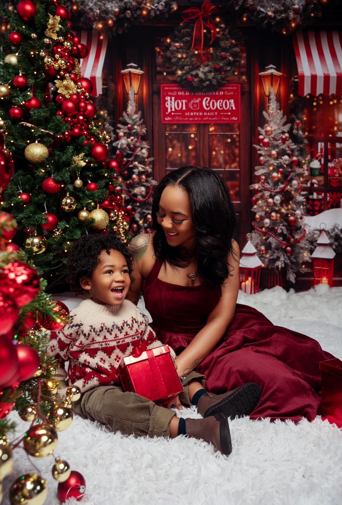 Mother and children sharing hot cocoa during a Christmas studio photo session